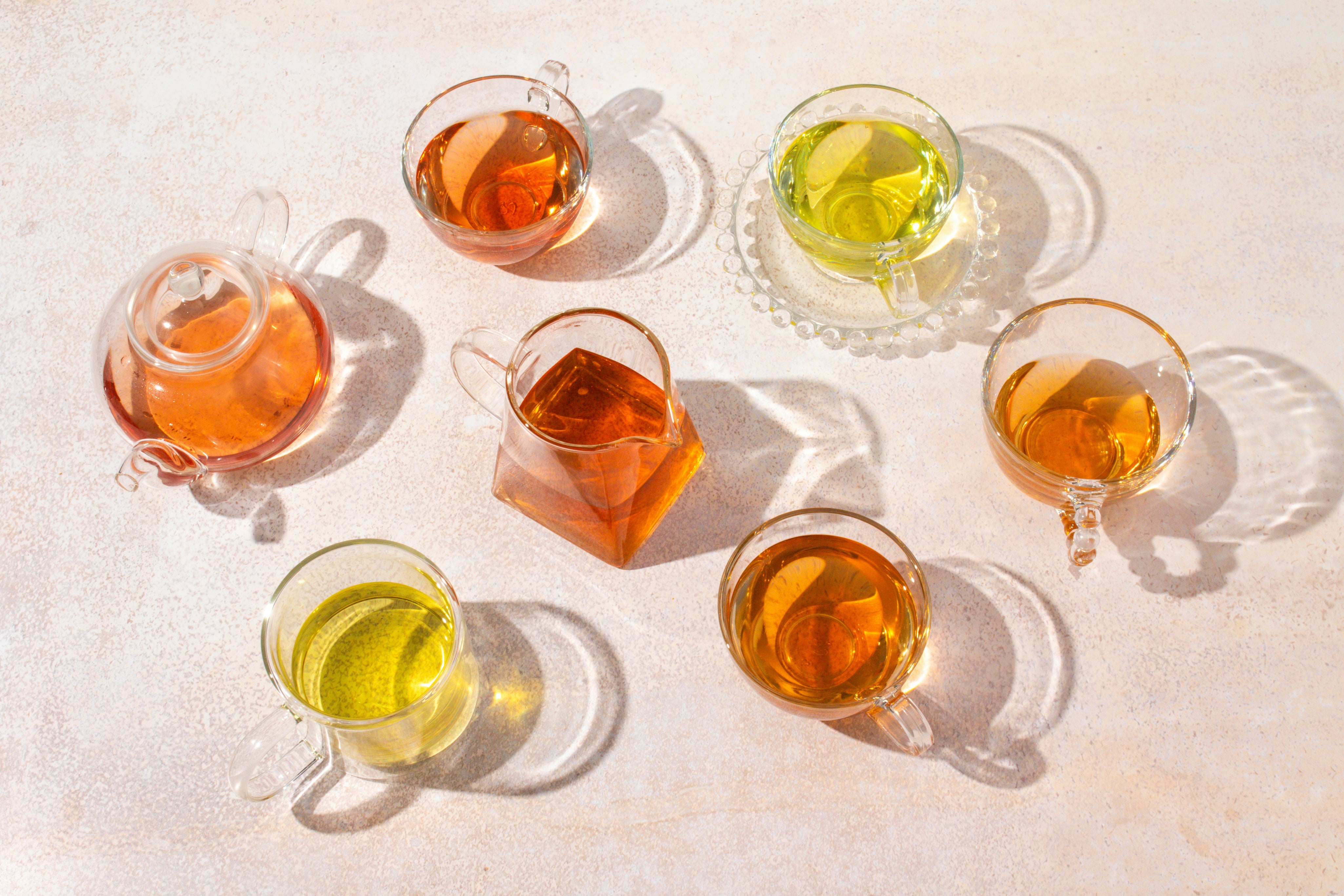 Teacups and tea pots in sunlight.