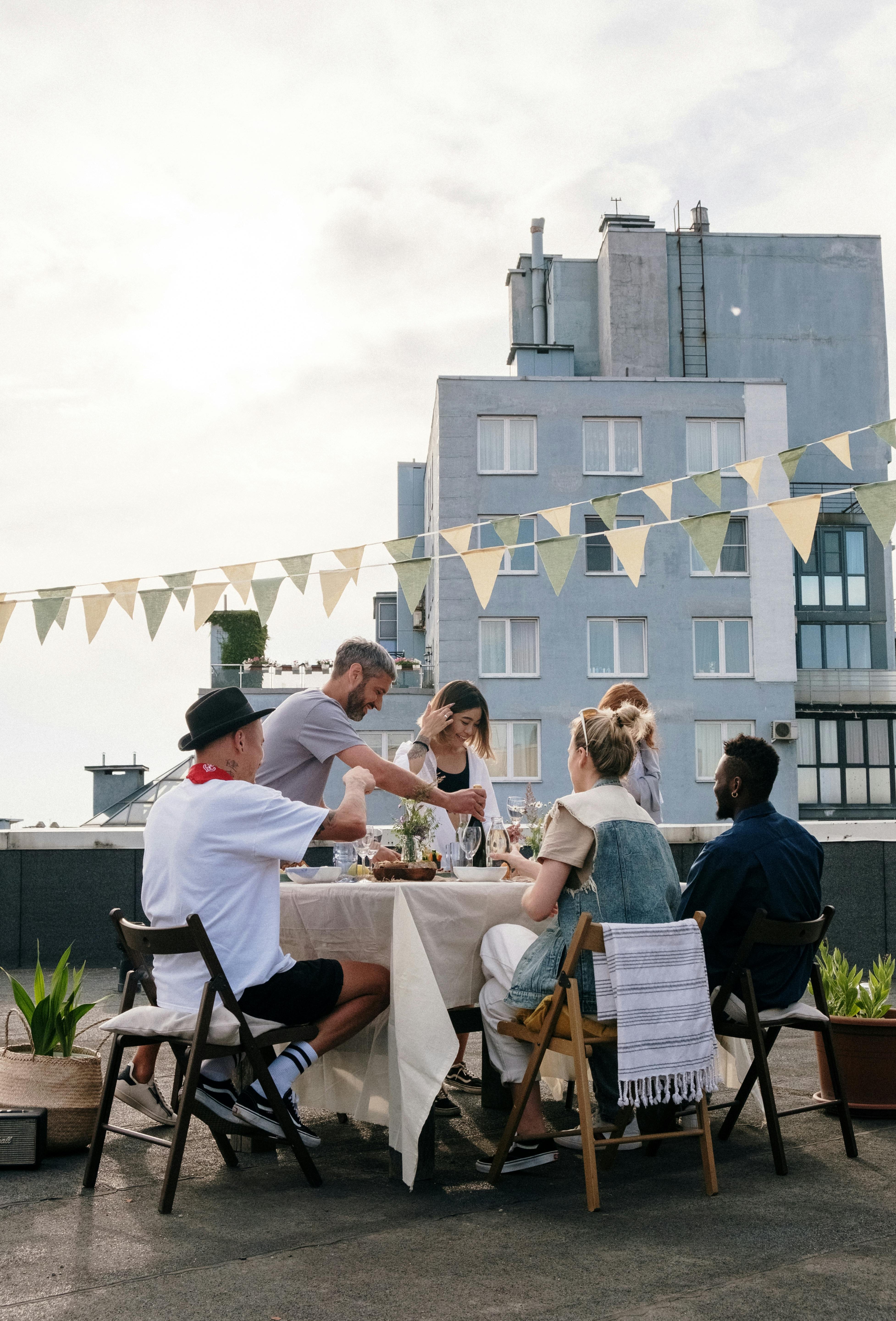 Chatley Mission image people around a table.